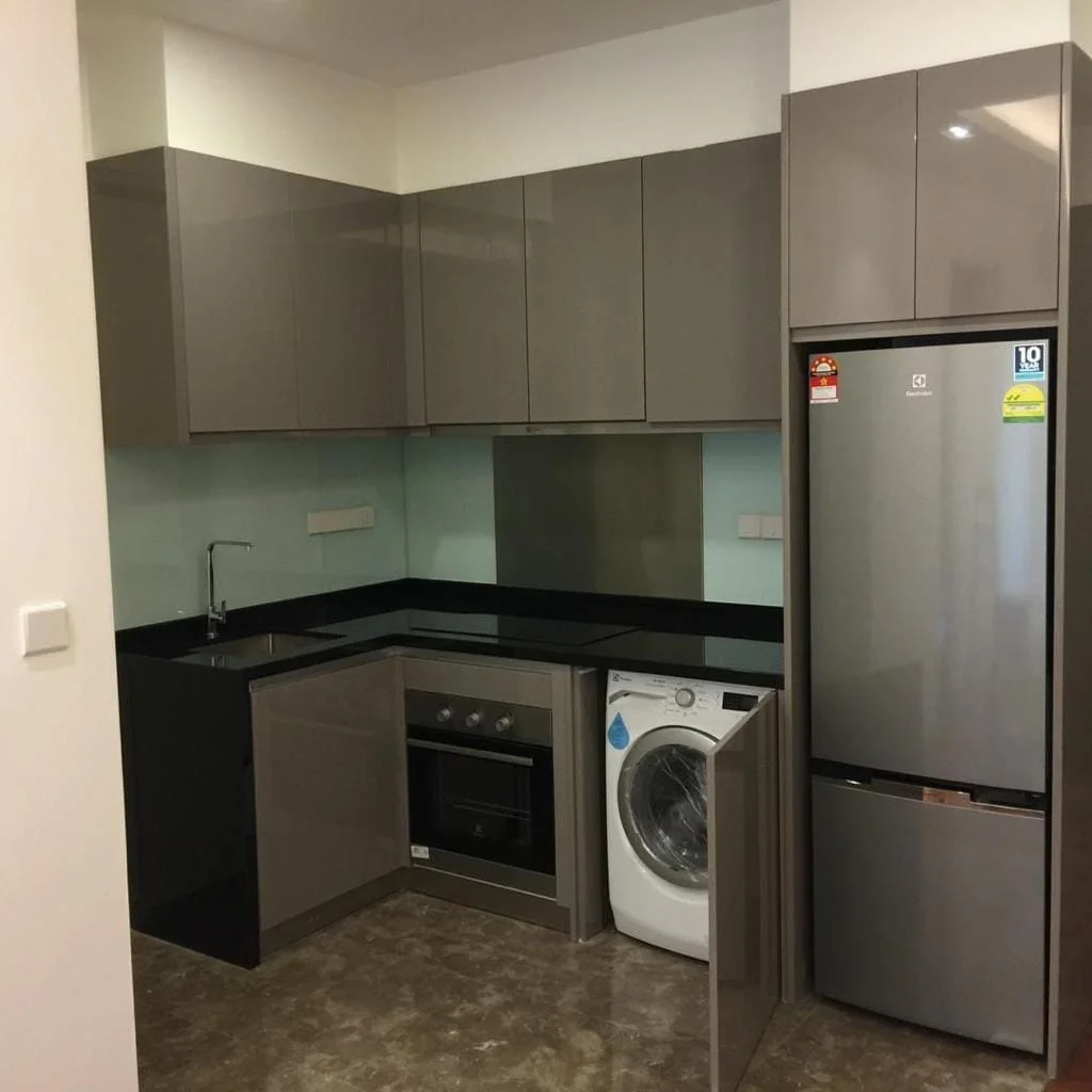 Kitchen features: grey flat-panel cabinets, black granite countertop, stainless-steel sink, chrome pull-down faucet, built-in oven, freestanding range oven, stainless-steel fridge, front-load washing machine, glass backsplash, tile flooring, recessed downlights; style: modern.